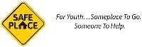 A yellow diamond-shaped sign with "Safe Place" written on it next to text reading "For Youth...Someplace To Go. Someone To Help." can be found near Ruiz Salon in Austin, offering both beauty and support to the community.